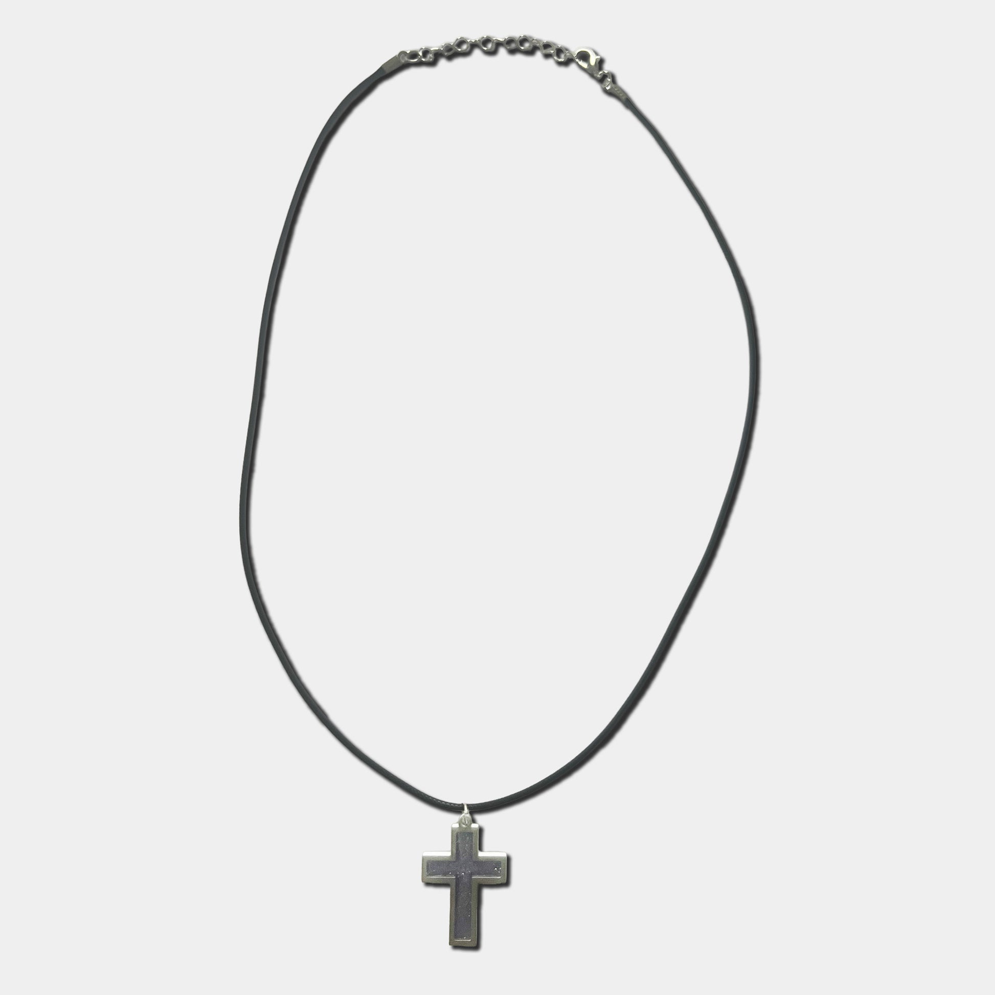 Black cord necklace with purple cross pendant on a white background