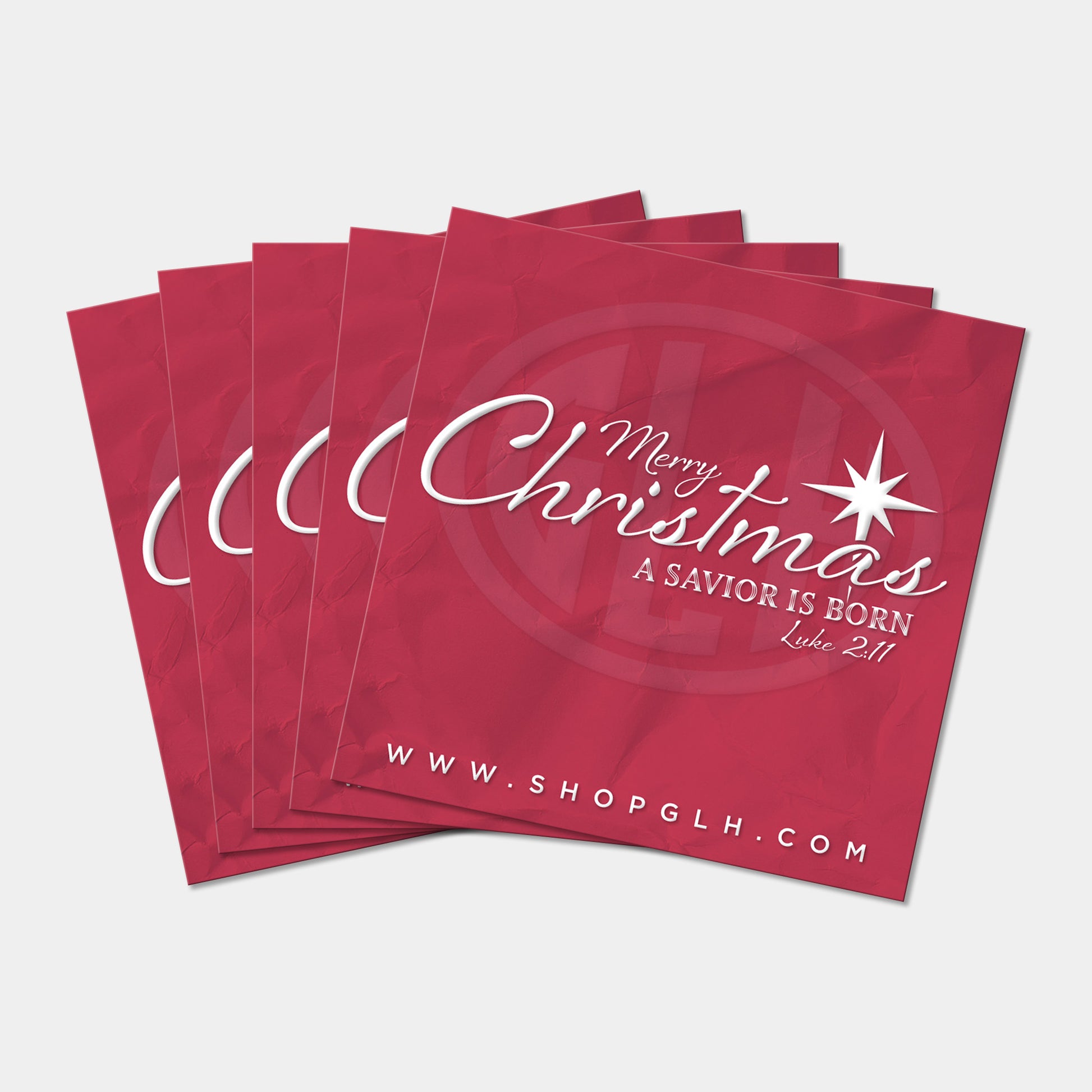 Stack of five red square stickers with 'Merry Christmas, A Savior is Born' text and star design on a white background.